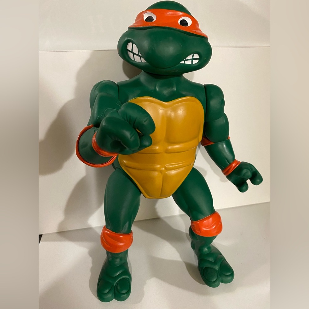 Green and Orange Action Figure